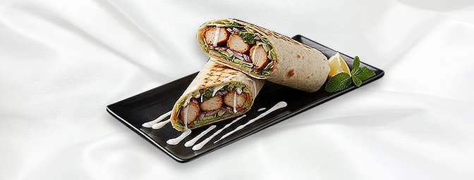 Chicken Seekh Kebab Wrap — Chicken Kebab served on naan bread, alongside ,fresh salad, and a special range of sauces, GB Cant