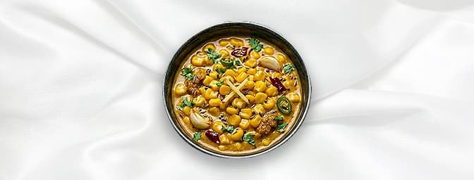 Corn Curry — Corn cooked in a thick medium strength sauce and chef special masala, GB Canteen Winchester