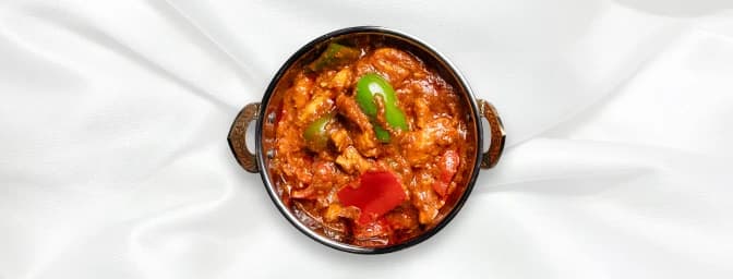 Chicken Jalfrezi — Barbequed chicken pieces cooked with tomatoes, onions, capsicum & green chilies in a fairly hot thick sauc