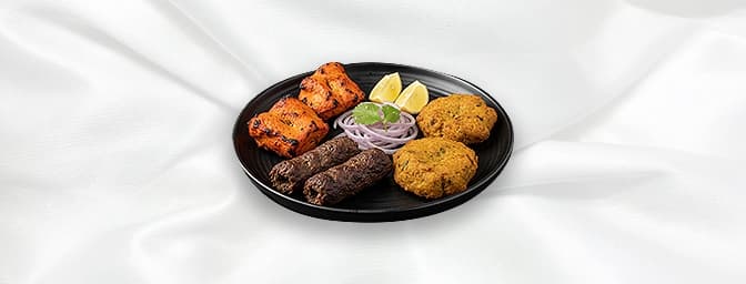 Mix Grill for 4 — A special mix of our favourites from the grill. A sizzling platter, containing seekh kebabs, chicken tikka,