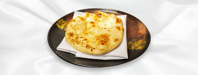 Naan — Soft, leavened flatbread cooked in a tandoor, ideal for pairing with curries, GB Canteen Farnham