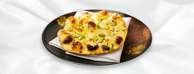 Tandoori Roti — Whole wheat flatbread cooked in a tandoor, providing a slightly firmer texture compared to naan, GB Canteen B