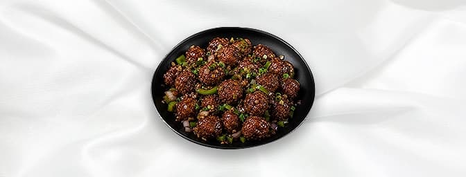 Vegetable Manchurian — Made with carrots, cauliflower, beans, spring onion sauce cooked in high flame with ginger, garlic, GB