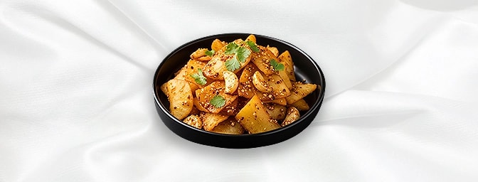 Garlic Chilli Mogo — Mogo fried and coated with garlic chilli sauce and spices topped with chopped spring onion, GB Canteen H