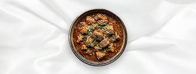 Chicken Tariwala — Experience a soulful taste of Punjab with this traditional North Indian specialty. Tender chicken is simme