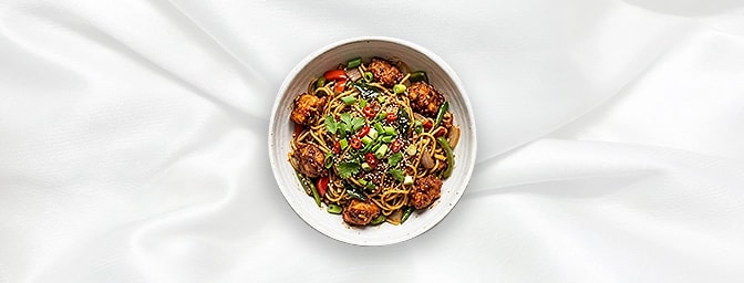 Chilli Chicken Noodle Bowl — A sophisticated Indo-Chinese fusion. Tender strips of stir-fried chicken are tossed with wok-cha
