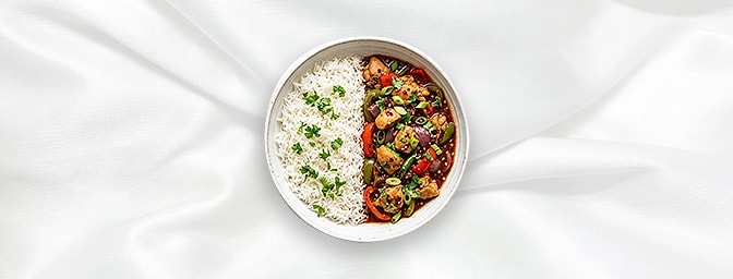 Chilli Chicken Rice Bowl — A soulful half-and-half combo featuring our fiery, stir-fried boneless chilli chicken. Tossed in a