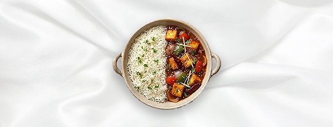 Chilli Paneer Rice Bowl — Experience the ultimate Indo-Chinese fusion. This vibrant bowl features golden cubes of cottage che
