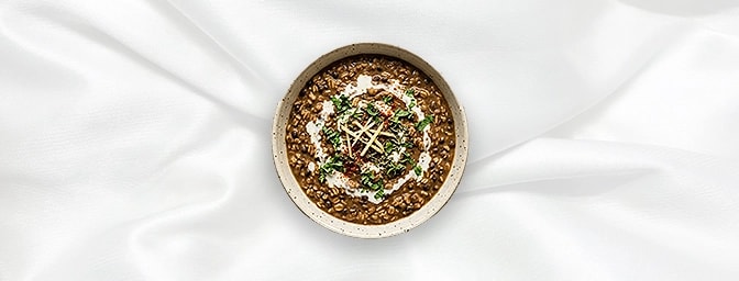 Dal Makhani Khichdi — Indulge in our signature Black Lentils�simmered overnight on the tandoor and finished with cream�served
