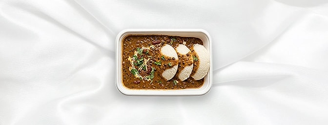 Dal Makhani with Idli — A match made in heaven. Earthy black lentils, slow-simmered overnight on the tandoor and finished wit