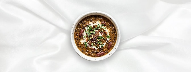 Dal Makhni - Taster — Experience the depth of our signature black lentils, simmered overnight on the tandoor and finished wit