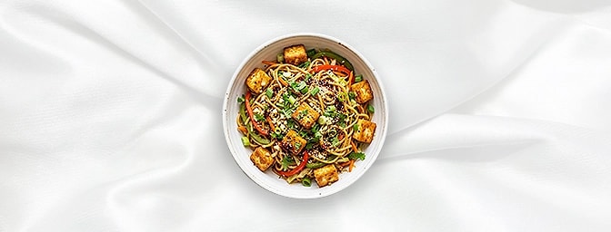 Garlic Paneer Noodle Bowl — Wok-tossed perfection meets the tandoor. Succulent cubes of paneer and stir-fried egg noodles are