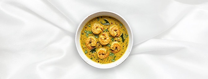 Goan Prawn Curry — Escape to the coast with this tangy, sunshine-filled curry. Succulent prawns are simmered in a vibrant ble