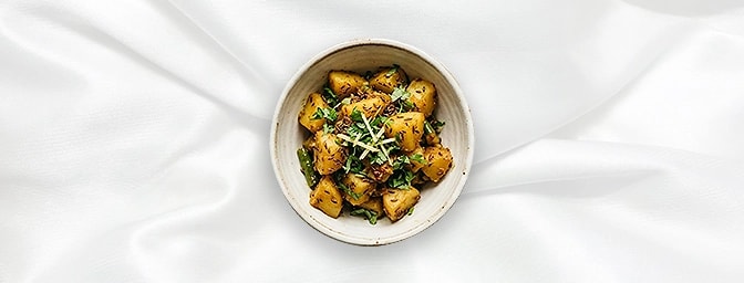 Jeera Aloo - Taster Portion — Perfect for a light bite, this taster portion features tender potato cubes tempered with toaste