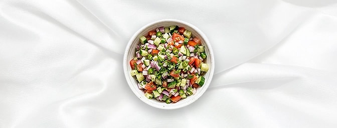 Kachumber Salad — A vibrant, sun-drenched medley of finely chopped cucumbers, tomatoes, and onions. Tossed with fresh coriand