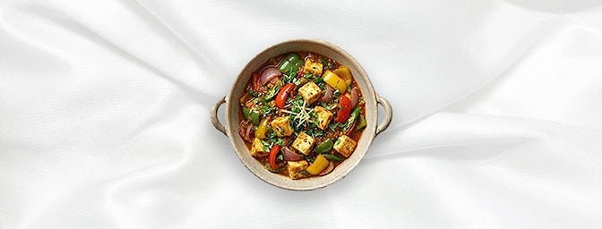 Paneer Jalfrezi — Our vibrant Paneer Jalfrezi, featuring succulent batons of fresh cottage cheese stir-fried with a colorful