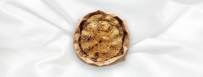 Poppadom Bag — The essential crunch. A generous bag of crisp, golden-fried poppadums. Perfect for dipping and sharing, these