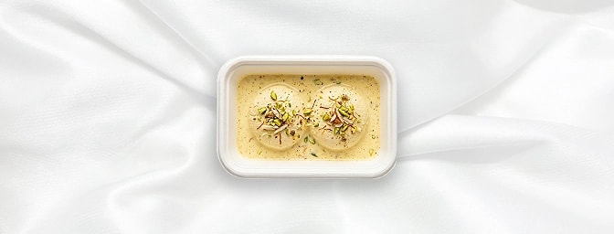 Rasmalai — featuring delicate, spongy cottage cheese discs soaked in saffron-infused, velvety milk, GB Canteen Marble Arch