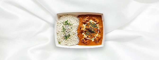 Butter Chicken Rice Bowl — Experience pure indulgence with our signature barbecued chicken cubes simmered in a velvet-smooth,