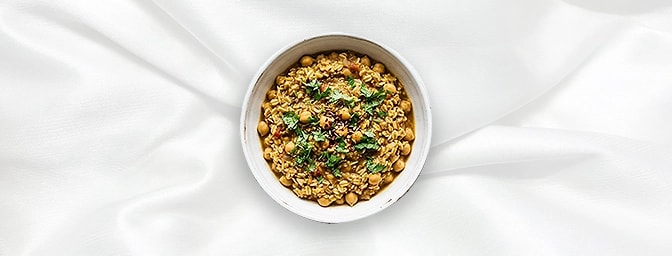 Chana Masala Khichdi — Indulge in the ultimate healthy comfort. Our signature Punjabi-style Chana Masala meets a velvety Oats