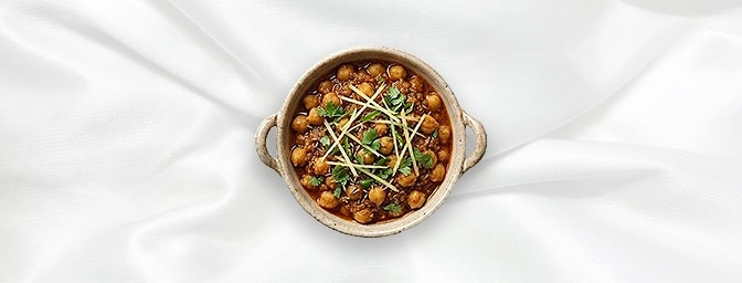 Chana Masala - Taster — A perfect snack-sized portion of our traditional Punjabi-style chickpeas. Slow-cooked with a refined