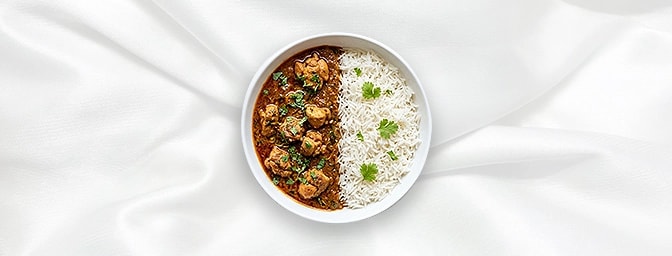 Chicken Tariwala Rice Bowl — Comfort in a bowl. Enjoy a traditional North Indian specialty of tender chicken simmered in a li