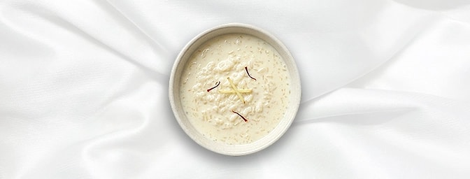 kheer — Experience the timeless elegance of this slow-cooked Indian rice pudding. Infused with aromatic green cardamom and sa