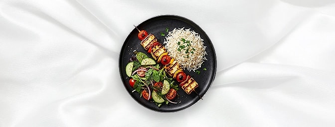 Grilled Halloumi Kebab V — Grilled Halloumi, Pepper And Tomato On A Skewer Served With Rice & Salad, GB Canteen Hitchin