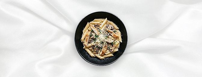 Penne Pollo — Penne Pasta, Strips Of Chicken, Mushroom In A Creamy White Wine Sauce Served With Parmesan Cheese, GB Canteen H