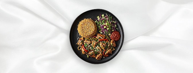 Sultan Tavuk — Stir Fried Chicken Mixed With Fried Peppers, Onions, Herbs And Blended With Garlic. Served With Bulgur, Salad