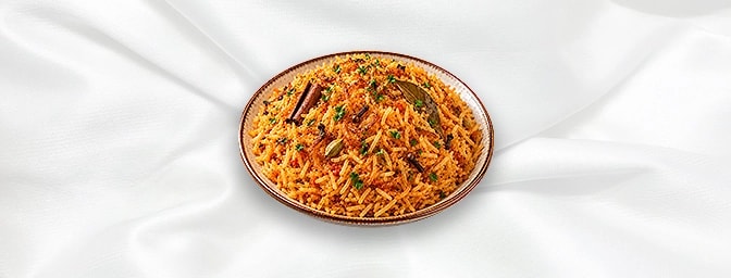 Bukhari Rice N — A traditional Middle Eastern rice dish cooked with a mix of spices, often including cinnamon, cloves, and ba