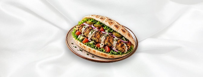 Chicken Kafta Sandwiches — Ground chicken mixed with a blend of onions, parsley, garlic, and spices, shaped into kebabs or pa