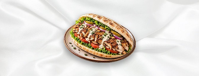 Chicken Shawarma Sandwiches — Like lamb shawarma but made with marinated chicken, cooked on a vertical rotisserie. The chicke
