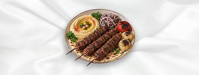 Lahim Meshou — marinated lamb cubes, served with hommous dip, grilled onions & tomato, GB Canteen Lebanese Barnes