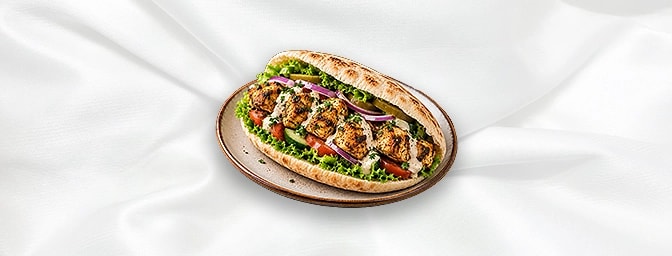 Taouk Sandwiches — A popular Middle Eastern grilled chicken skewer, marinated in a mix of yogurt, garlic, lemon, and spices,