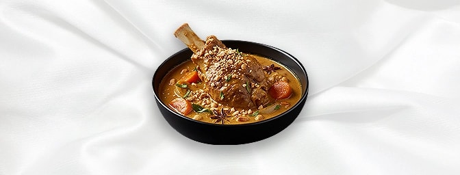 Lamb Shank Massaman Curry — Slow-cooked lamb shank in Massaman curry with coconut milk, GB Canteen Petts Wood Thai