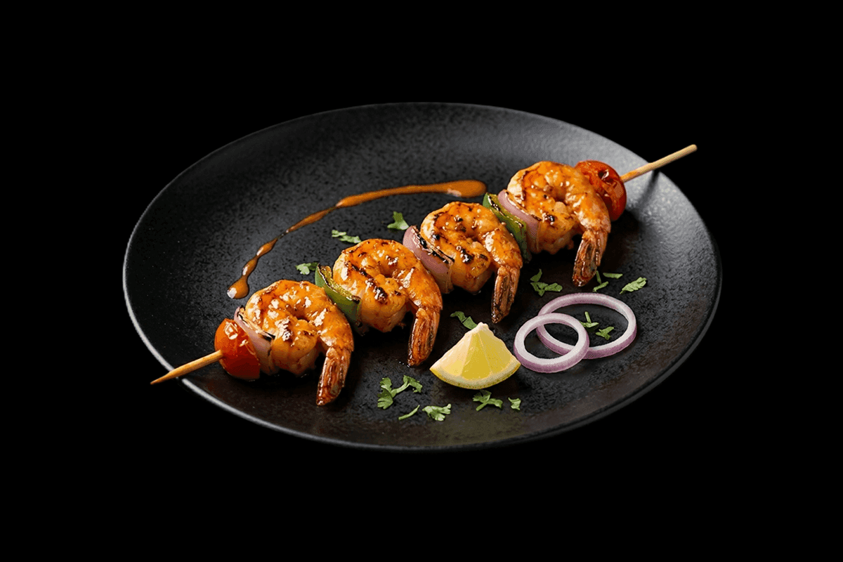 King Prawn Shaslik — Marinated king prawns mixed with coriander and spices grilled with onions, capsicum and tomatoes, GB Can