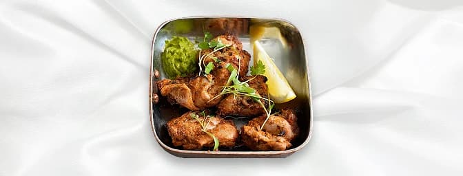 Chicken Tikka — Tender cubes of meat marinated in special tikka sauce & cooked in the tandoor, GB Canteen Billericay