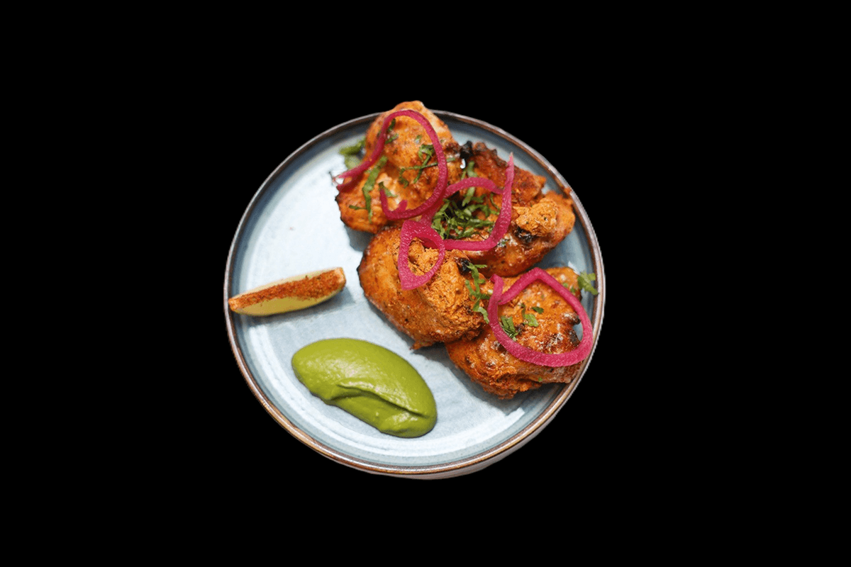 Chicken Tikka main — Boneless chicken or lamb pieces marinated with mild spices and grilled in the tandoor, GB Canteen Woodfo