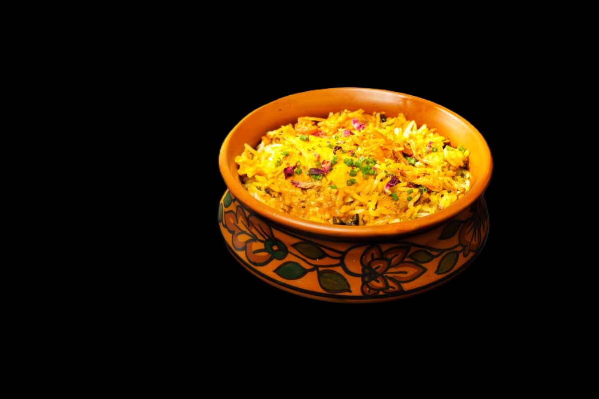 Tandoori King Prawn Biryani — Large prawns marinated in a spicy yogurt mix and cooked in a traditional tandoor , giving them