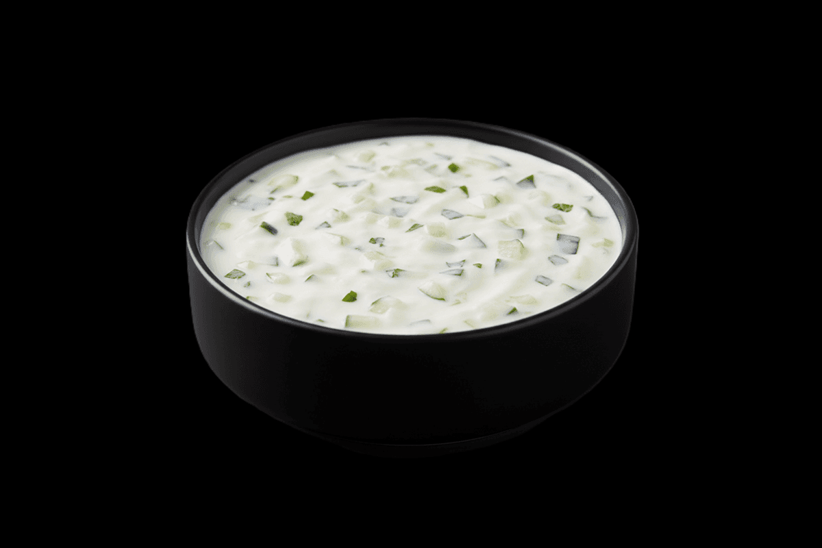 Cucumber Raita — Finely chopped cucumber mixed with yoghurt, roasted cumin, and black salt, GB Canteen Maidenhead