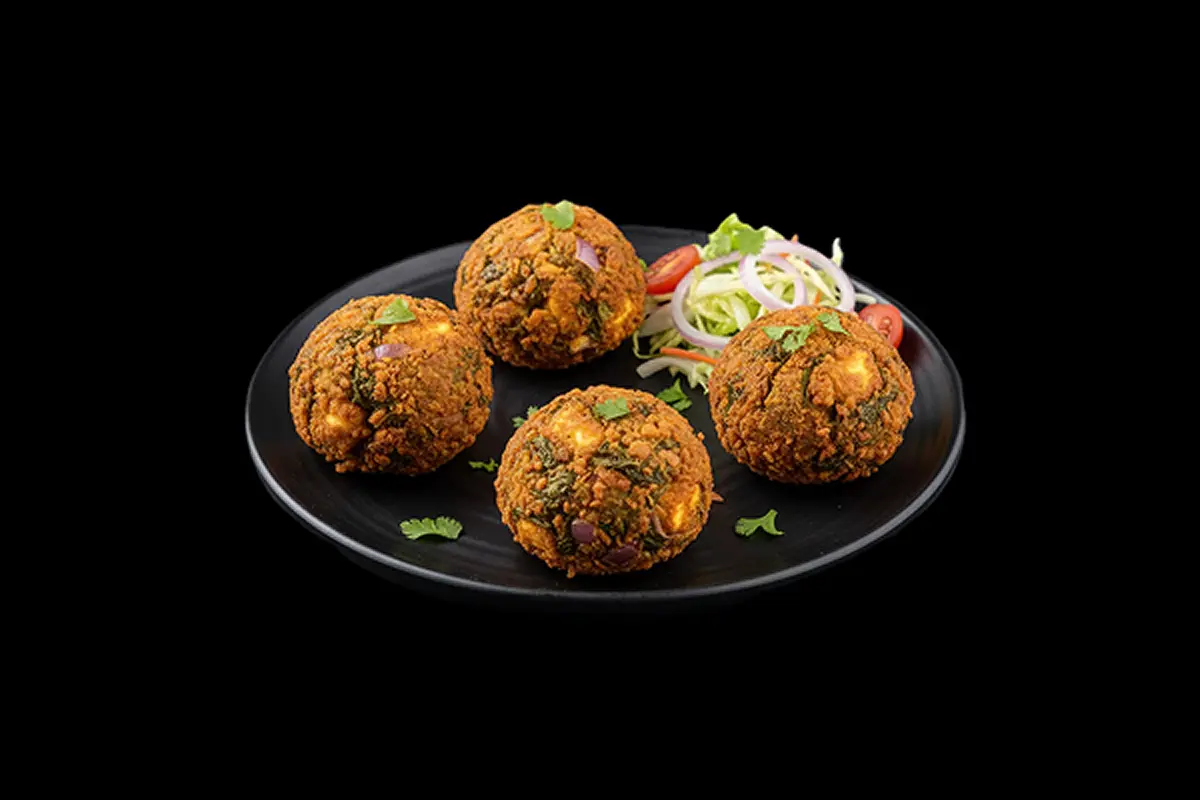 Palok Panir Pakora — Crispy round balls made with spinach, onions, and cheese. Served with salad, GB Canteen Wellington