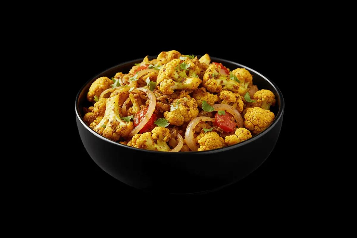 Cauliflower Bhaji — Cauliflower cooked in a mildly spiced curry sauce, often with onions, tomatoes, and cumin. Its a flavorfu