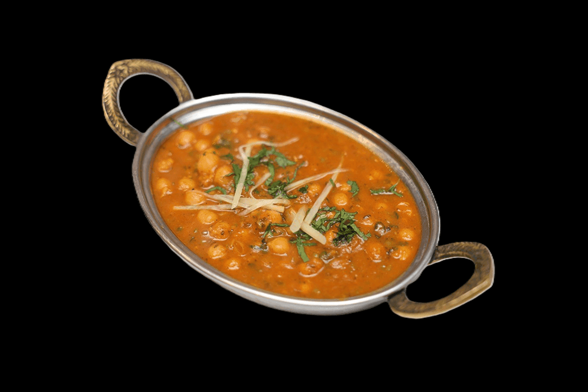 Chana Masala — A hearty dish made with chickpeas cooked in a spiced tomato-based gravy. Its flavorful and perfect for pairing