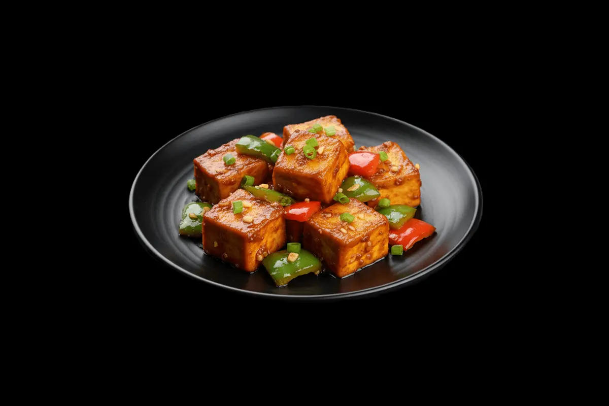 Chilli Paneer — Paneer cubes cooked in a spicy, tangy sauce with green chilies, garlic, and peppers. A delicious vegetarian a
