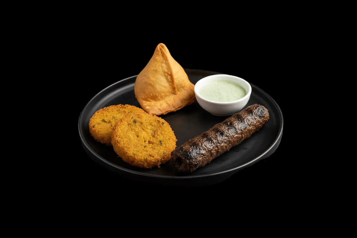 House Platter — A combination of various appetizers, often including samosas, kebabs, and bhajis, GB Canteen Woodford Indian