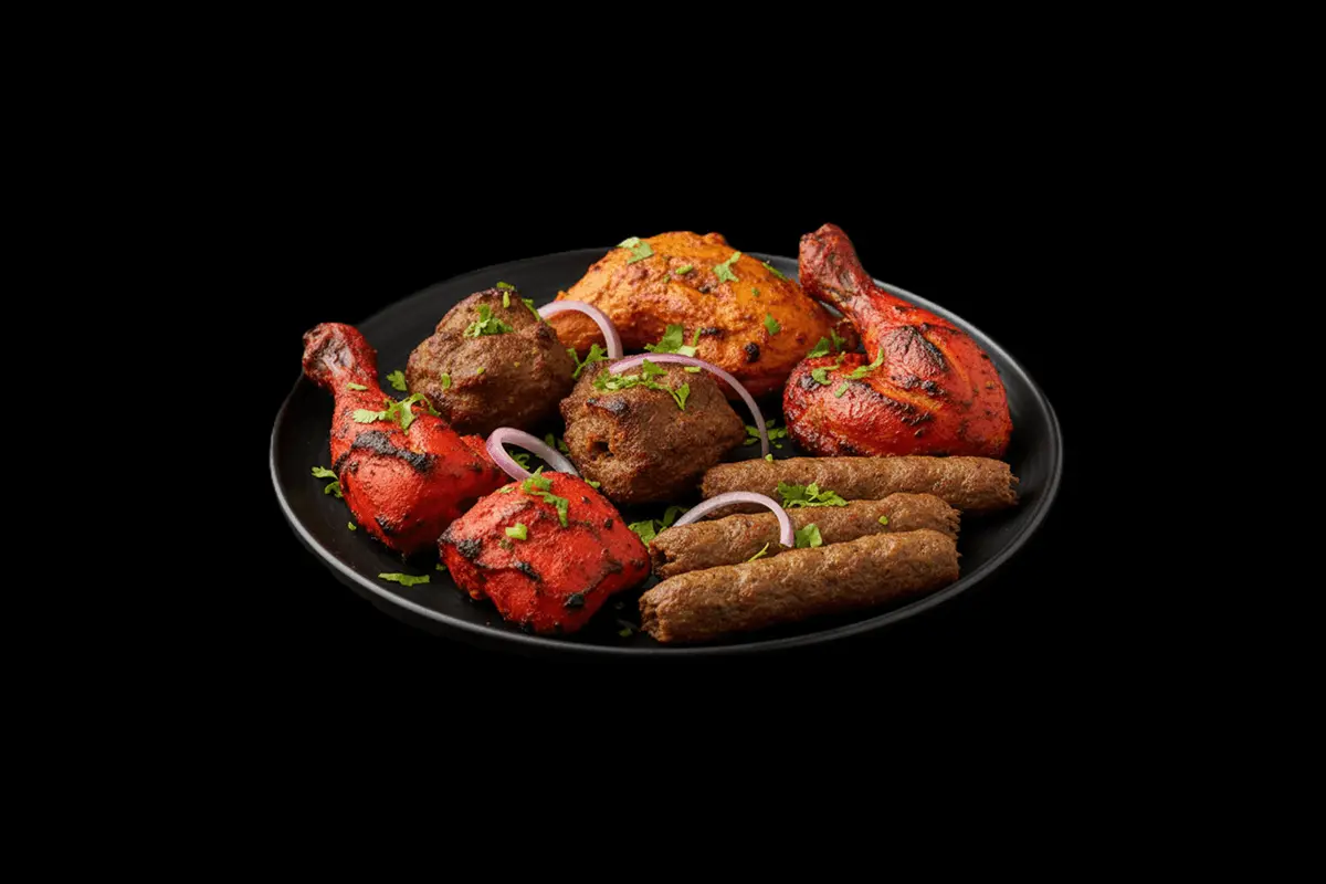 Tandoori Mixed Grill — A plate of mouth-watering Tandoori specialities include pieces of king prawn, chicken tikka, sheek keb