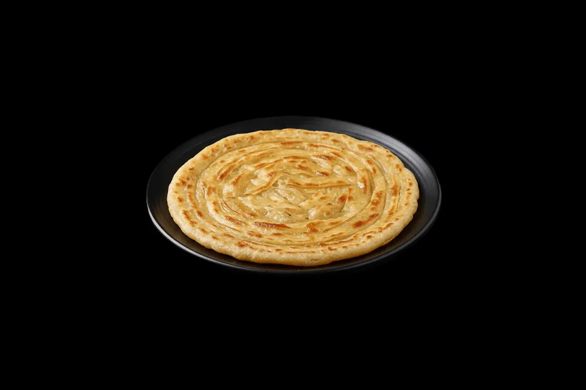 Special Paratha — A layered, flaky flatbread, often cooked with ghee, providing a rich, indulgent texture. Its a great choice