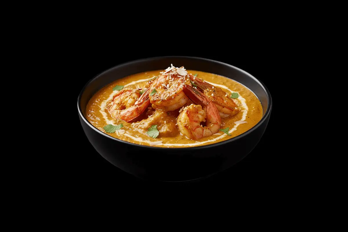 Tandoori King Prawn Masala — Marinated large prawns cooked in a creamy sauce made from almonds and coconuts, a fusion of spec